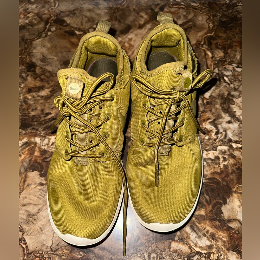 Olive green Nike Roshe.